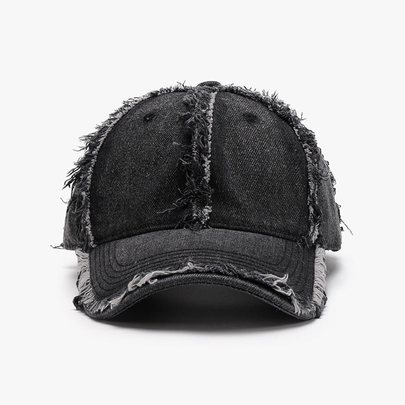 Gorra de béisbol de algodón desgastada en negro con detalles rasgados y estilo vintage