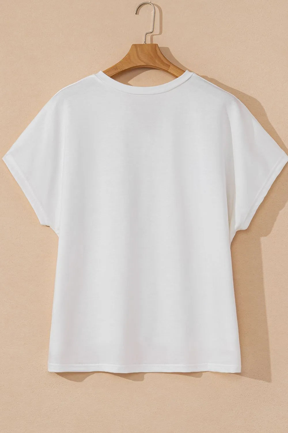 Blusa floral con mangas dolman en color blanco con diseño cómodo y elegante